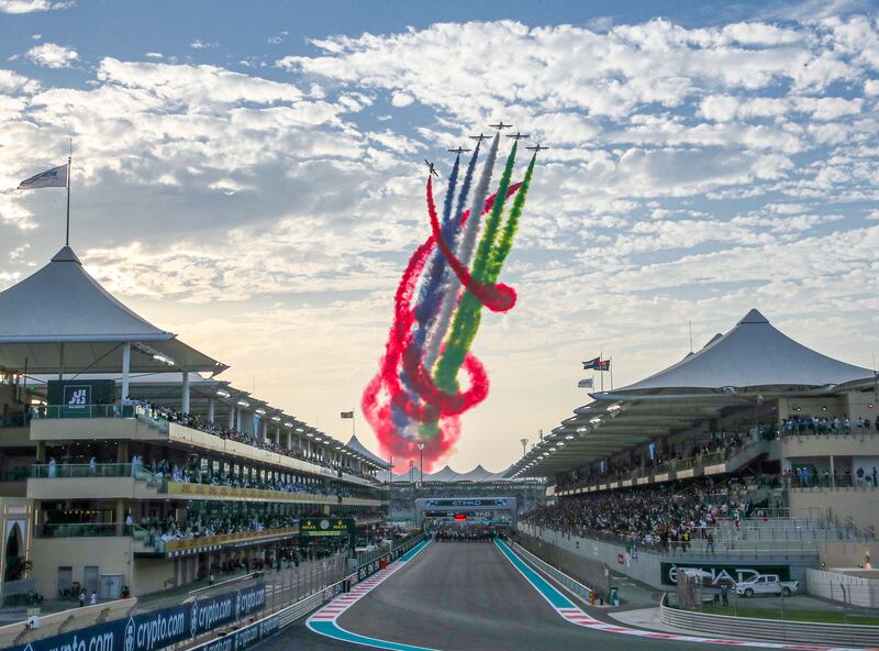 Al Fursan aerial display team over Yas Marina Circuit before the start of the Abu Dhabi Formula One Grand Prix. Victor Besa / The National