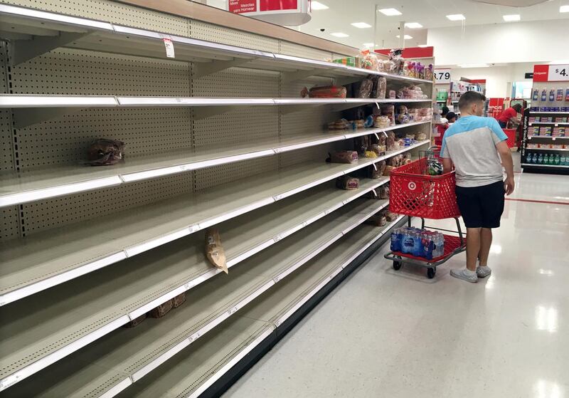 Shoppers encounter empty bread shelves at a store in Kissimmee. Reuters