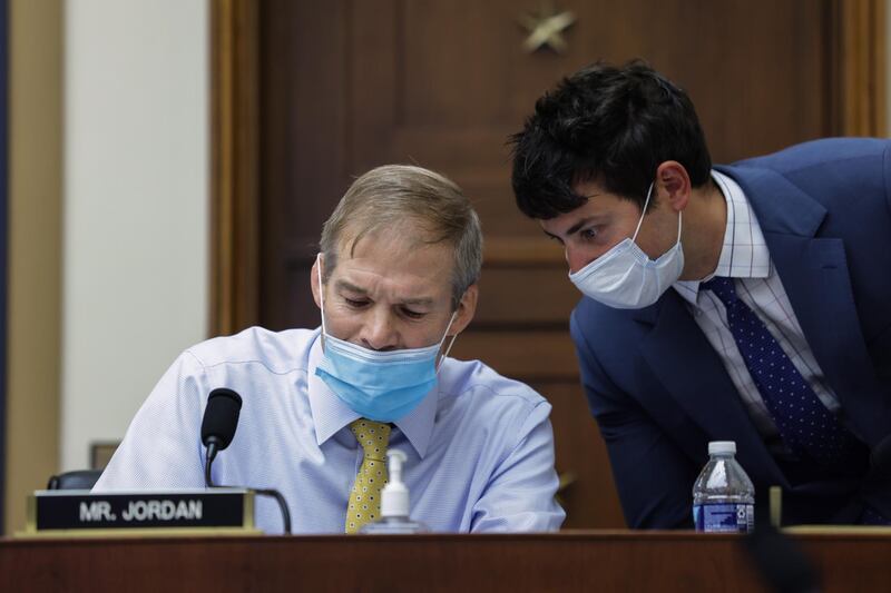 Congressman Jim Jordan, confers with a congressional staff member. EPA