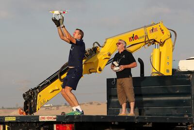 DUBAI , UNITED ARAB EMIRATES ,  November 22 , 2018 :- Left to Right -  Patrick Bol ( rower ) and Trevor Cantwell ( drone controller ) learning how to use drones in the desert for Atlantic tour near the Al Warsan Pet Market in Dubai. They will be using drones for filming during the challenge. ( Pawan Singh / The National )  For News. Story by Nick Webster 