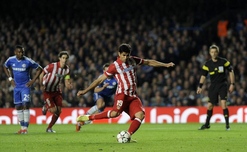 Atletico Madrid striker Diego Costa scores from a penalty during his side's Champions League victory over Chelsea on Wednesday. Gerry Penny / EPA / April 30, 2014