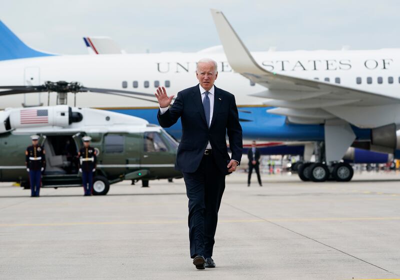 Joe Biden waves as he crosses the tarmac next to Air Force One at Munich International Airport. The US president is leaving Germany on his way to Spain to attend a Nato summit. AP