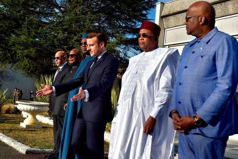 (From L) Mauritanian President Mohamed Ould Ghazouani, Malian President Ibrahim Boubacar Keita, Chadian President Idriss Deby, French President Emmanuel Macron, Nigerien President Mahamadou Issoufou and Burkinabe President Roch Marc Christian Kabore attend a ceremony in Pau, south-western France, on January 13, 2020, in memory of the seven soldiers of the 5eme regiment d’helicopteres de combat (RHC) who were killed in Mali in November 2019, and ahead of a meeting with Heads of State who are gathering to discuss the continuing anti-jihadist fight in the African region of Sahel.
  / AFP / POOL / Alvaro BARRIENTOS
