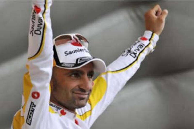 Leonardo Piepoli celebrates after clinching the first mountain-top finish of the 2008 Tour de France.