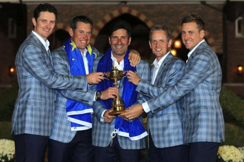 MEDINAH, IL - SEPTEMBER 30: (L-R) Justin Rose, Lee Westwood, Jose Maria Olazabal, Luke Donald and Ian Poulter pose with the Ryder Cup after Europe defeated the USA 14.5 to 13.5 to retain the Ryder Cup during the Singles Matches for The 39th Ryder Cup at Medinah Country Club on September 30, 2012 in Medinah, Illinois.   David Cannon/Getty Images/AFP== FOR NEWSPAPERS, INTERNET, TELCOS & TELEVISION USE ONLY ==

