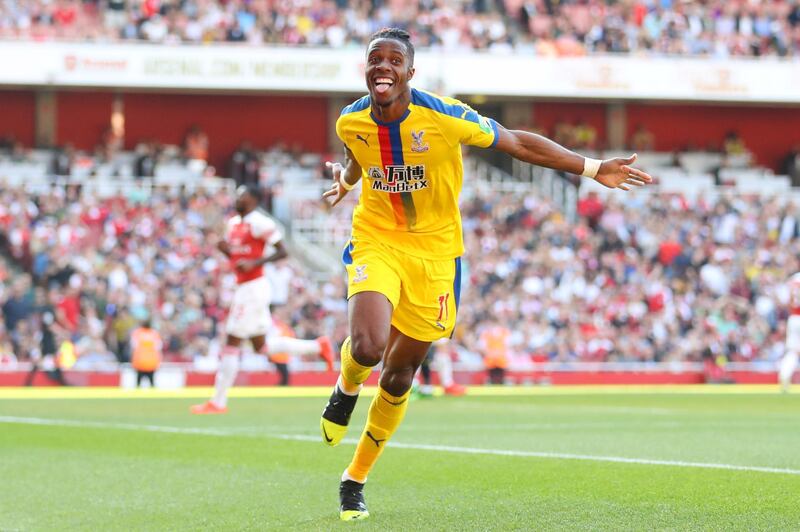 LONDON, ENGLAND - APRIL 21: Wilfried Zaha of Crystal Palace celebrates after scoring his team's second goal during the Premier League match between Arsenal FC and Crystal Palace at Emirates Stadium on April 21, 2019 in London, United Kingdom. (Photo by Warren Little/Getty Images)