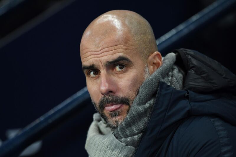 Manchester City's Spanish manager Pep Guardiola looks on during the League Cup first leg semi-final football match between Manchester City and Burton Albion at the Etihad stadium in Manchester, northwest England on January 9, 2019. / AFP / Paul ELLIS
