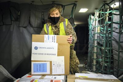 BRIZE NORTON, ENGLAND - FEBRUARY 01: RAF personnel load a batch of the Covid-19 vaccine onto a Voyager aircraft bound for the Falkland Islands at RAF Brize Norton on February 01, 2021 in Brize Norton, England. The British armed forces are handling delivery of the first batch of the Oxford-AstraZeneca Covid-19 vaccines to the residents of the Falkland Islands, with a flight leaving RAF Brize Norton in the early hours of February 1, 2021. The British military operation to support the Foreign Commonwealth and Development Office is addressing the COVID-19 pandemic overseas, primarily in the British Overseas Territories, such as the Falkland Islands, the Ascension Islands and Gibraltar. (Photo by Leon Neal/Getty Images)