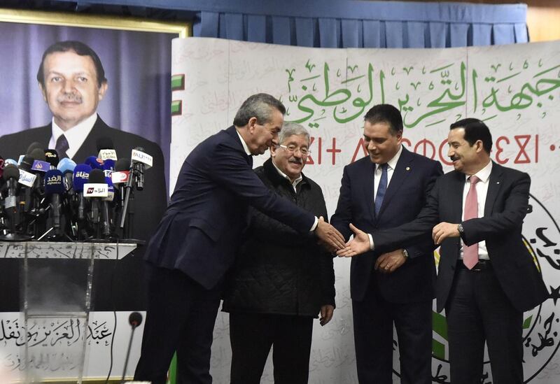 Algerian Ministers and representatives of the president-candidate Abdelaziz Bouteflika shake hands after a political meeting in the capital Algiers. AFP
