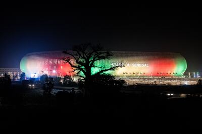 The new Senegalese Olympic stadium, covered in the  National colours is pictured ahead of its inauguration in Diamniadio. AFP