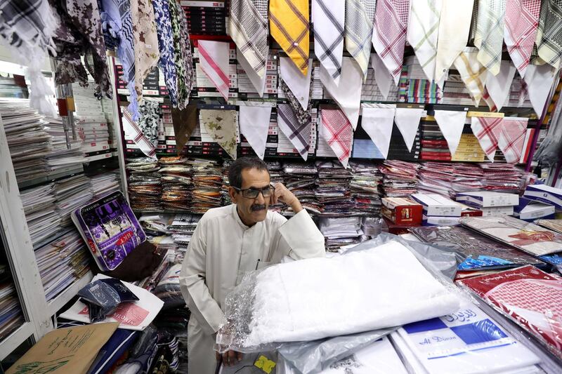 Abu Dhabi, United Arab Emirates - July 30, 2019: Abdulrahman Abdullah, from southern Iran talks about Hajj at Jamal tailoring. Monday the 30th of July 2019. Madinat Zayed Shopping Centre, Abu Dhabi. Chris Whiteoak / The National