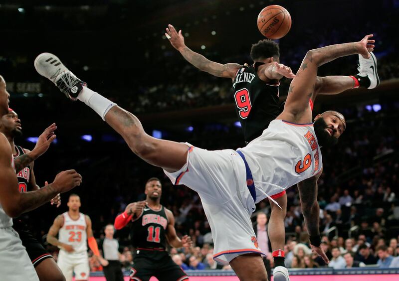 New York Knicks center Kyle O'Quinn  is fouled by Chicago Bulls guard Antonio Blakeneyduring the second quarter of an NBA basketball game in New York. Julie Jacobson / AP Photo