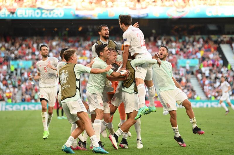 Mikel Oyarzabal is mobbed by teammates after scoring Spain's fifth goal in their Euro 2020 last-16 win over Croatia, at the Parken Stadium in Copenhagen, on Monday, June 28.