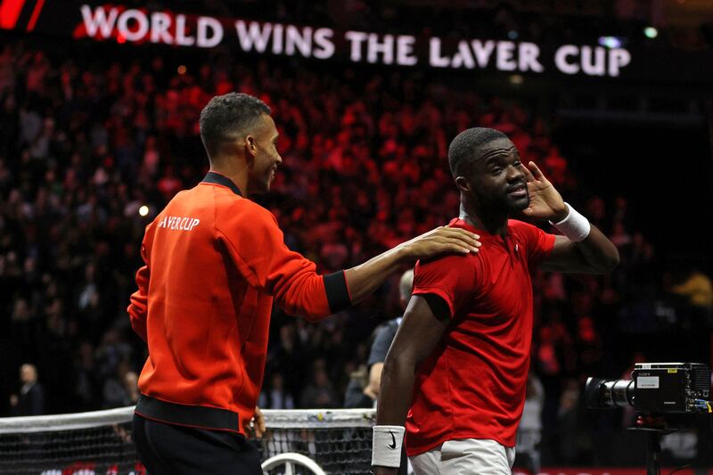USA's Frances Tiafoe (R) and Canada's Felix Auger-Aliassime (L) of Team World celebrate on the court. AFP