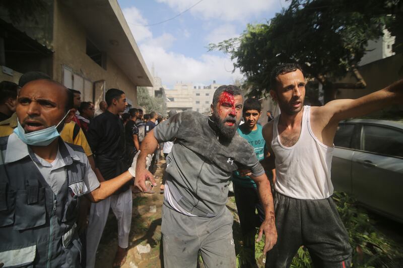 Palestinians are evacuated from buildings in Rafah after the bombardment of the Gaza Strip. AP