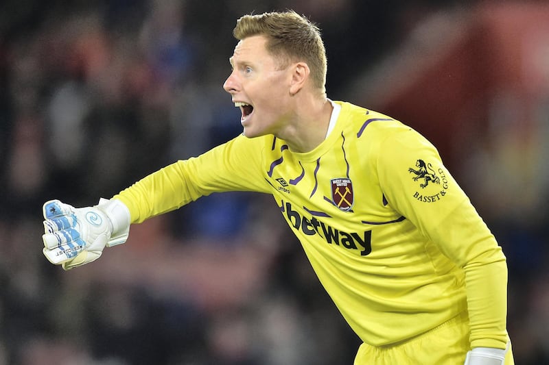 West Ham United's English goalkeeper David Martin gestures during the English Premier League football match between Southampton and West Ham United at St Mary's Stadium in Southampton, southern England on December 14, 2019. (Photo by Glyn KIRK / AFP) / RESTRICTED TO EDITORIAL USE. No use with unauthorized audio, video, data, fixture lists, club/league logos or 'live' services. Online in-match use limited to 120 images. An additional 40 images may be used in extra time. No video emulation. Social media in-match use limited to 120 images. An additional 40 images may be used in extra time. No use in betting publications, games or single club/league/player publications. / 
