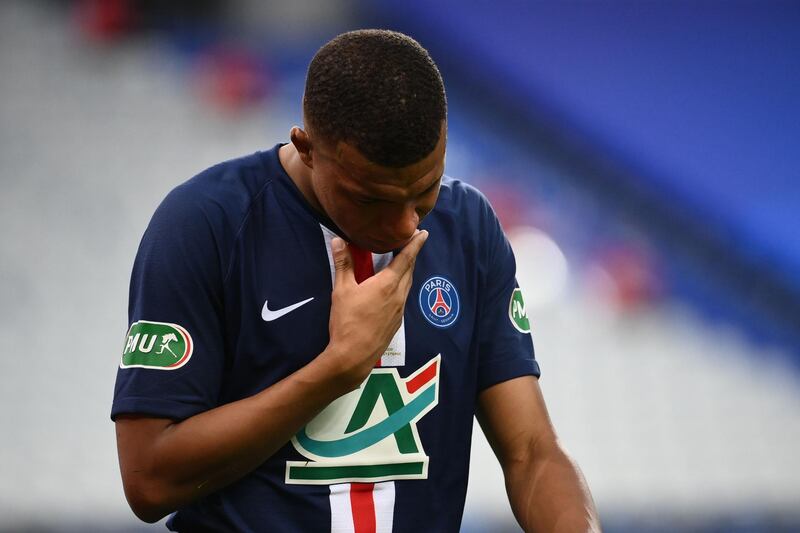 Kylian Mbappe leaves the pitch after his injury. AFP