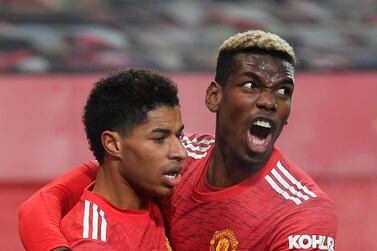 Manchester United's Marcus Rashford celebrates with Paul Pogba after scoring the winner against Wolves. EPA