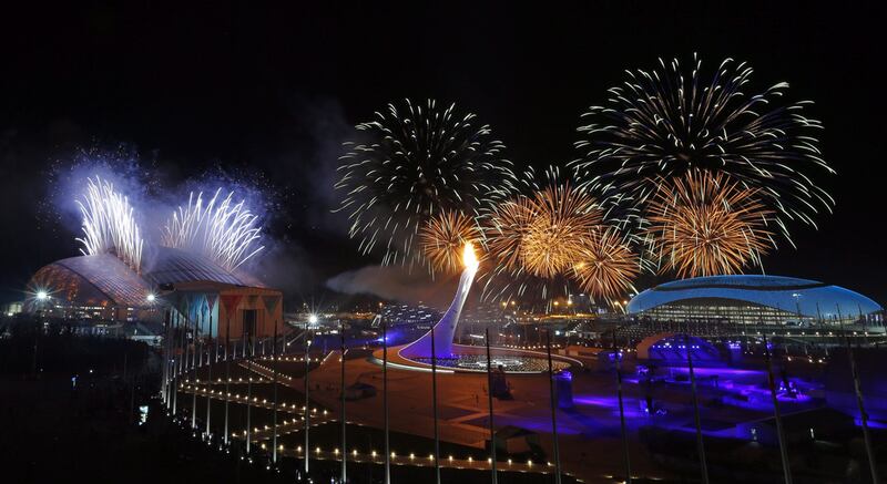 Fireworks are seen over the Olympic Park during the opening ceremony of the 2014 Winter Olympics in Sochi, Russia. Doping allegations have cast a shadow of suspicion over Russia's athletes (AP Photo/Julio Cortez)