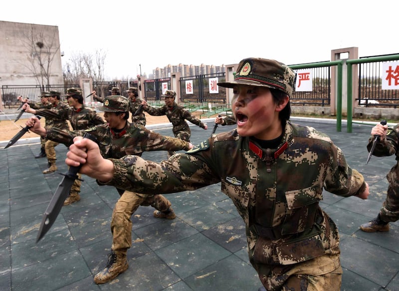 Female members of China's paramilitary police taking part in a drill ahead of International Women's Day in Hefei in China's eastern Anhui province. AFP Photo
