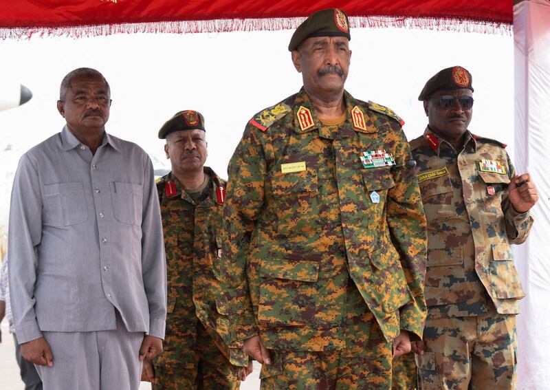 Sudanese Armed Forces chief Gen Abdel Fattah Al Burhan, centre, at a military airport in Port Sudan in August 2023. Reuters