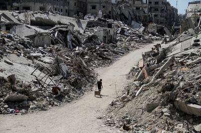 A Palestinian walks among the rubble of buildings destroyed during Israel's military offensive in Beit Lahia, northern Gaza. Reuters
