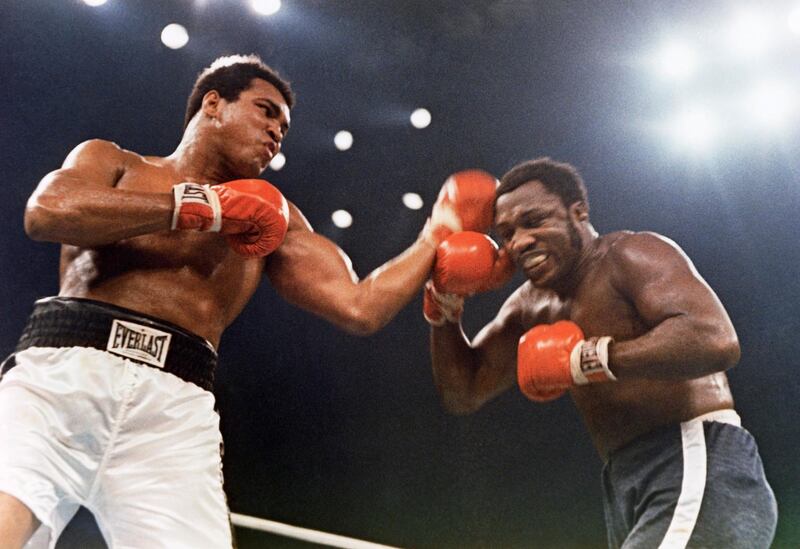 Muhammad Ali, left, and Joe Frazier are shown in action in the 12-round non-title fight that took place at Madison Square Garden in New York, Jan. 28, 1974. (AP Photo)