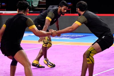 In this photograph taken on August 27, 2019, India's Siddharth Desai (C) of the Telugu Titans takes part in a training session with teammates ahead of a Pro Kabaddi League (PKL) match, at Thyagaraj Sports Complex in New Delhi. The ancient sport of kabaddi has undergone a glitzy makeover through the Pro Kabaddi League (PKL), creating a new group of sports stars in a country traditionally obsessed with cricket. - To go with 'KABADDI-IND-INDIA,FOCUS' by Faisal KAMAL
 / AFP / Sajjad HUSSAIN / To go with 'KABADDI-IND-INDIA,FOCUS' by Faisal KAMAL
