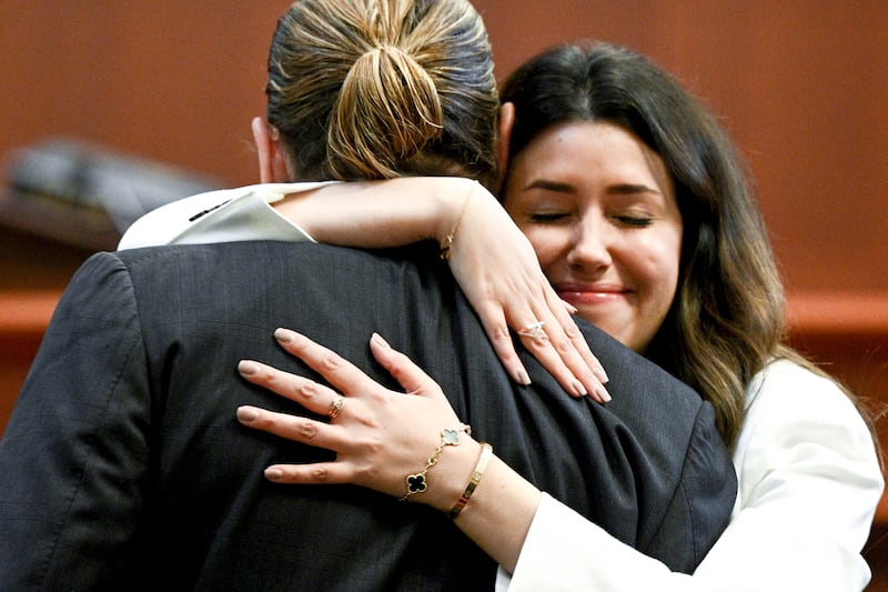 Depp hugs Ms Vasquez. AP