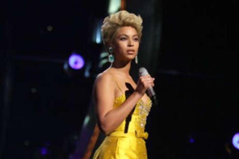 Beyoncé performs as Etta James in Zuhair Murad's gold cocktail dress.