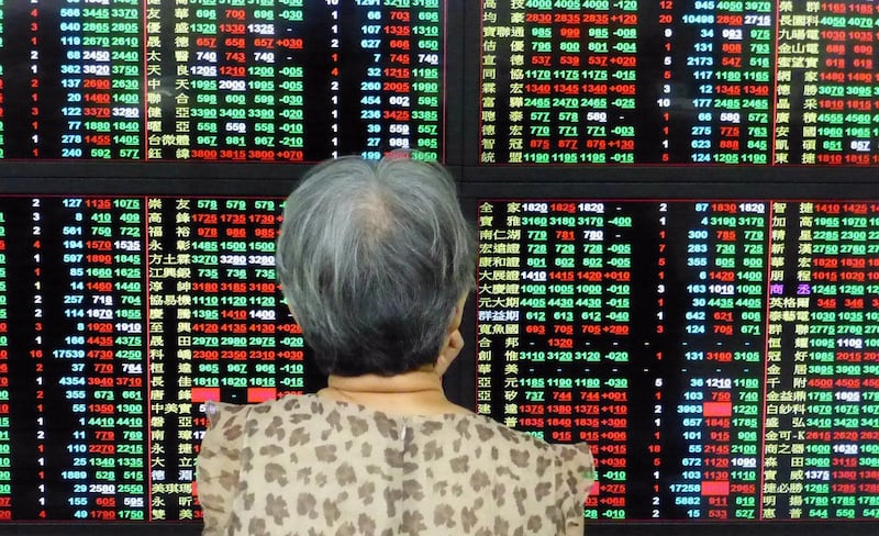 epa06772910 An investor watches a monitor at a stock exchange in Taipei, Taiwan, 30 May 2018. On 30 May, Asian stocks tumbled following large overnight loss on Wall Street due to political uncertainty in Italy, and the US will impose a 25 percent tariff on Chinese high-tech goods. The TAIEX index fell 142.95 points, or 1.3 percent, to close at 10,821.17 points.  EPA/DAVID CHANG