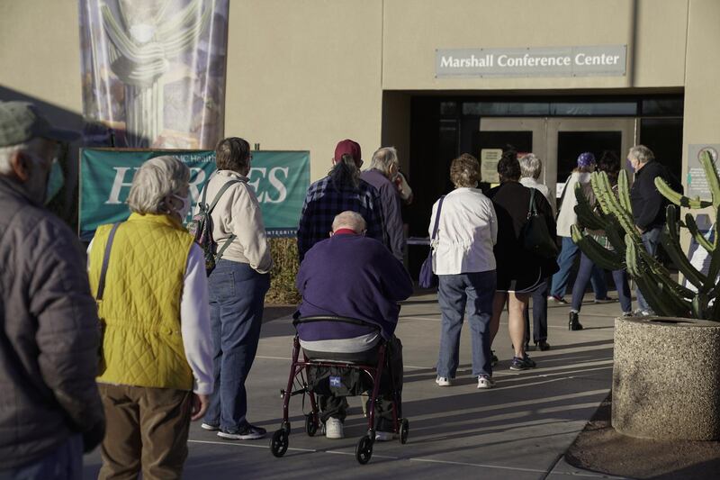 People wait in line to receive a Covid-19 vaccine in Tucson, Arizona. Bloomberg