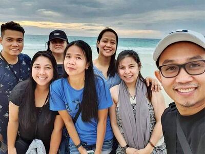 The teachers on their holiday, before disaster struck. Andrew Valenzuela, on the left, next to Eden Perales, front left, both died along with Jaquelyn Alferez, third from the right. Antoneth Canoy-Tolledo, Jaquelyn Alferez, Catherine Joy Santillan and Mark Angelo Subaldo survived.