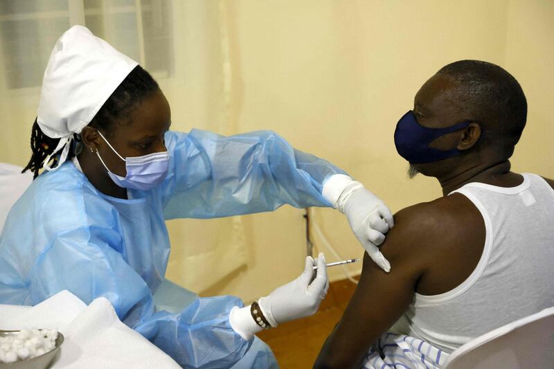 Administering a second dose of Astra Zeneca vaccine to a patient in a Covid-19 vaccination centre in Kigali, Rwanda. AFP