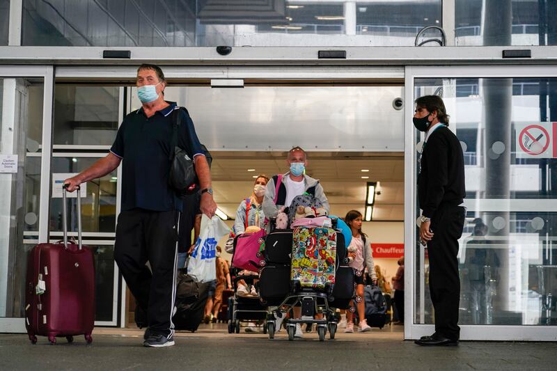 Bosses at London's Gatwick Airport want to ease the Covid conditions that incoming travellers have to meet. AP