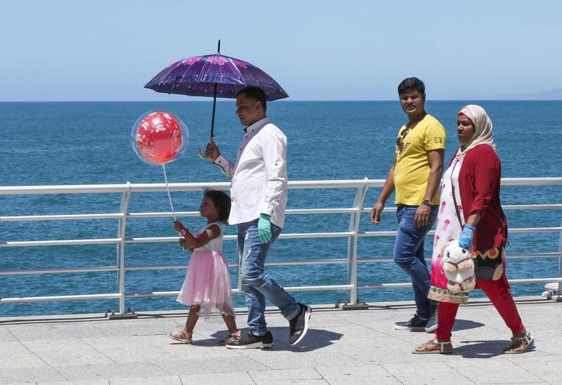 People walk along the seaside promenade in the Lebanese capital Beirut during Eid Al Fitr. FP