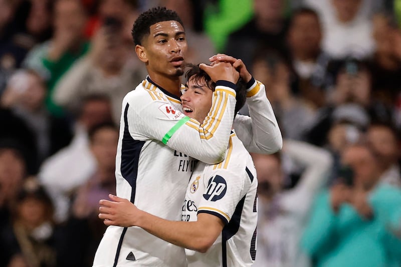 Real Madrid's Brahim Diaz celebrates scoring with teammate Jude Bellingham. AFP