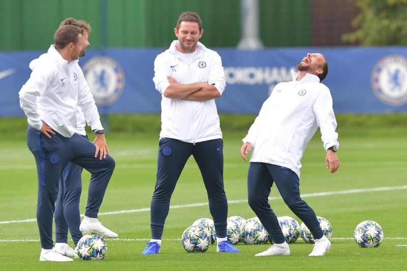 Chelsea manager Frank Lampard, centre, enjoys a joke with his coaching staff in training ahead of their Uefa Champions League match against Valencia on Tuesday. The Spanish team had the last laugh, though, by winning the match in London 1-0. AFP