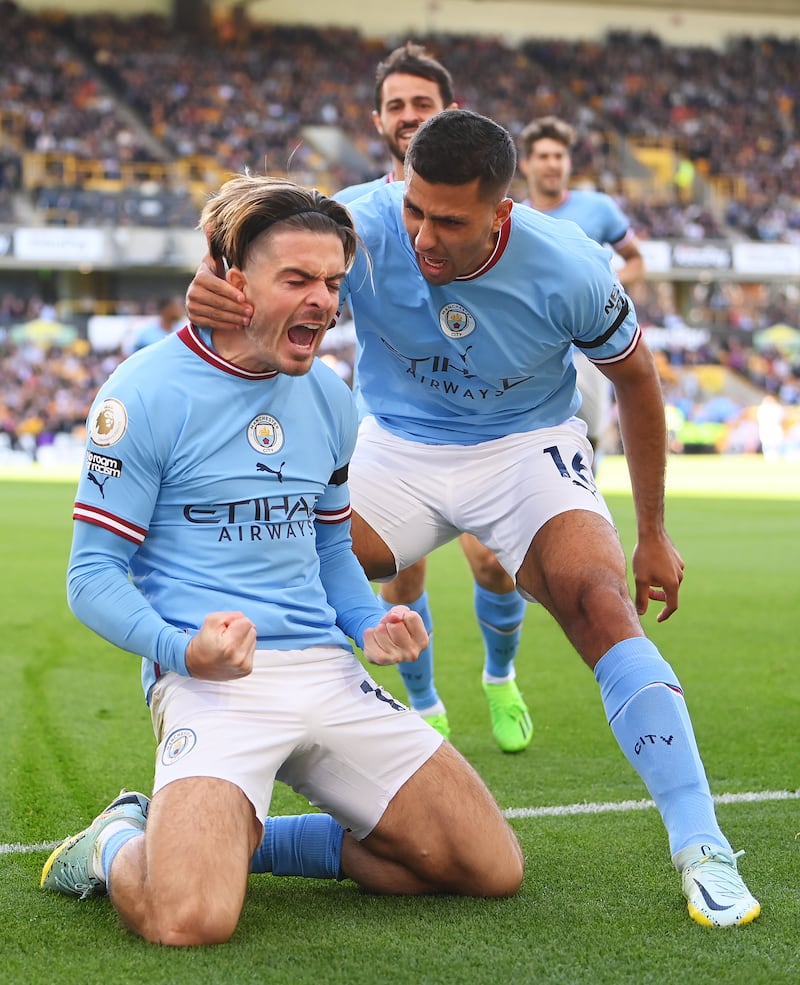 Grealish celebrates with Rodri. Getty