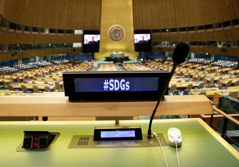 Empty desks fill the UN General Assembly Hall as speakers deliver remarks remotely at the SDG Moment event in 2021. EPA
