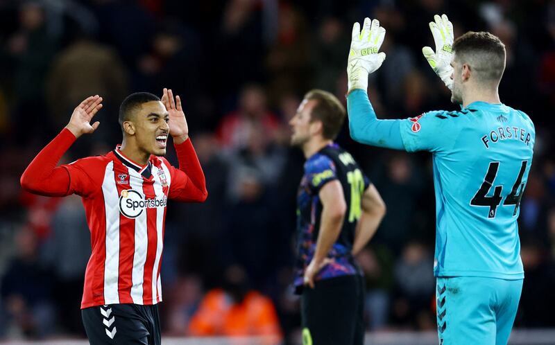 Soccer Football - Premier League - Southampton v Tottenham Hotspur - St Mary's Stadium, Southampton, Britain - December 28, 2021 Southampton's Yan Valery and Fraser Forster celebrate after the match REUTERS/David Klein EDITORIAL USE ONLY.  No use with unauthorized audio, video, data, fixture lists, club/league logos or 'live' services.  Online in-match use limited to 75 images, no video emulation.  No use in betting, games or single club /league/player publications.   Please contact your account representative for further details. 