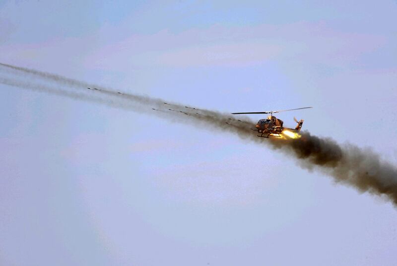 An Iranian Army helicopter launches a weapon during a military exercise in the north-west of the country, close to the border with Azerbaijan. AFP