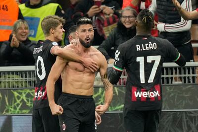 AC Milan's Olivier Giroud, centre, celebrates with his teammates after scoring his side's second goal against Spezia. AP Photo