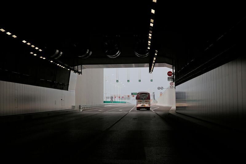 A vehicle drives through a tunnel. AP Photo