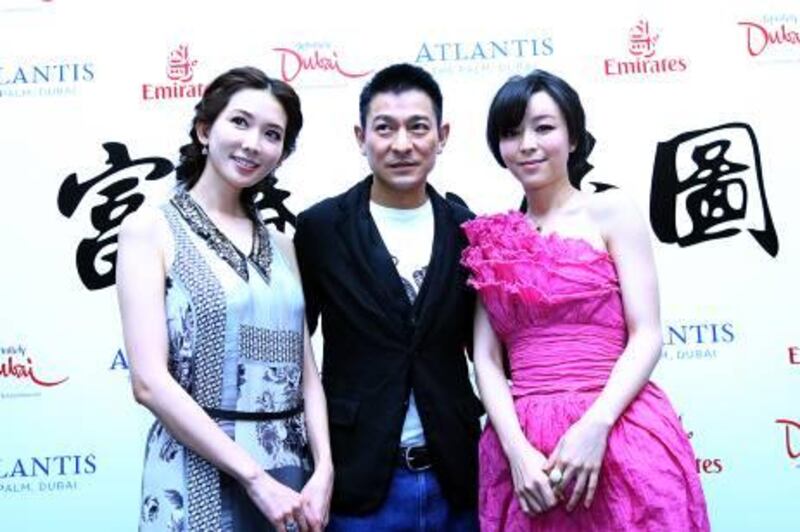 Dubai,  United Arab Emirates- January,  10, 2012: ( L to R )  Actors Lin Chi Ling,  Andy Lau, and Zhang Jingchu  pose for the photographers during the media conference at the  Atlantis Hotel  in Dubai . (  Satish Kumar / The National )