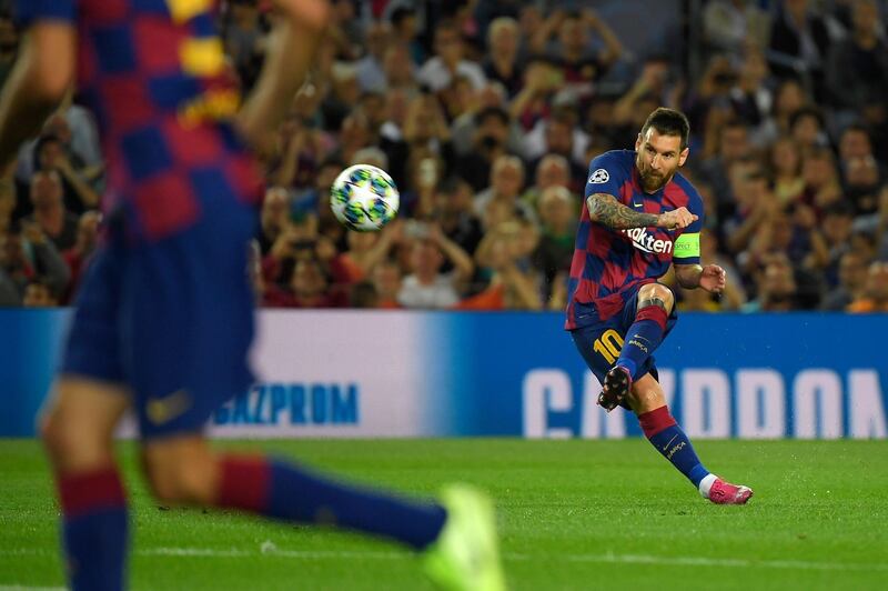 Barcelona's Lionel Messi kicks the ball. AFP