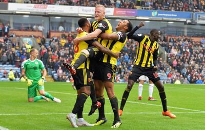 Watford's Will Hughes, centre, celebrates scoring his side's third goal of the game against Burnley, during their English Premier League soccer match at Turf Moor in Burnley, England, Sunday Aug. 19, 2018. (Dave Howarth/PA via AP)