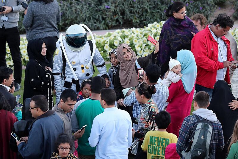 DUBAI , UNITED ARAB EMIRATES , JAN 31 – 2018 :- People taking their photos with the astronaut at the Al Thuraya Astronomy Center in Mushrif Park in Dubai.  (Pawan Singh / The National) For News. Story by Nawal