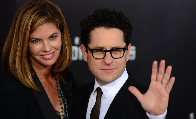 Director and producer J.J Abrams and partner pose on arrival for the Los Angeles premiere of the movie 'Star Trek Into Darkness" in Hollywood, California on May 14, 2013. The film opens nationwide on May 15. AFP PHOTO/Frederic J. BROWN
 *** Local Caption ***  116751-01-08.jpg