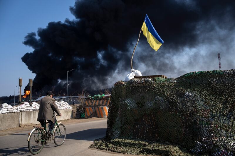 Black smoke billows from a fuel depot near Kyiv that was used by the Ukrainian Army before it was hit by during a Russian strike. AP